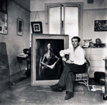 Dobell in his studio w ith Portrait o f an artist (Joshua Smith) in 1943. Photograph courtesy Betty Churcher